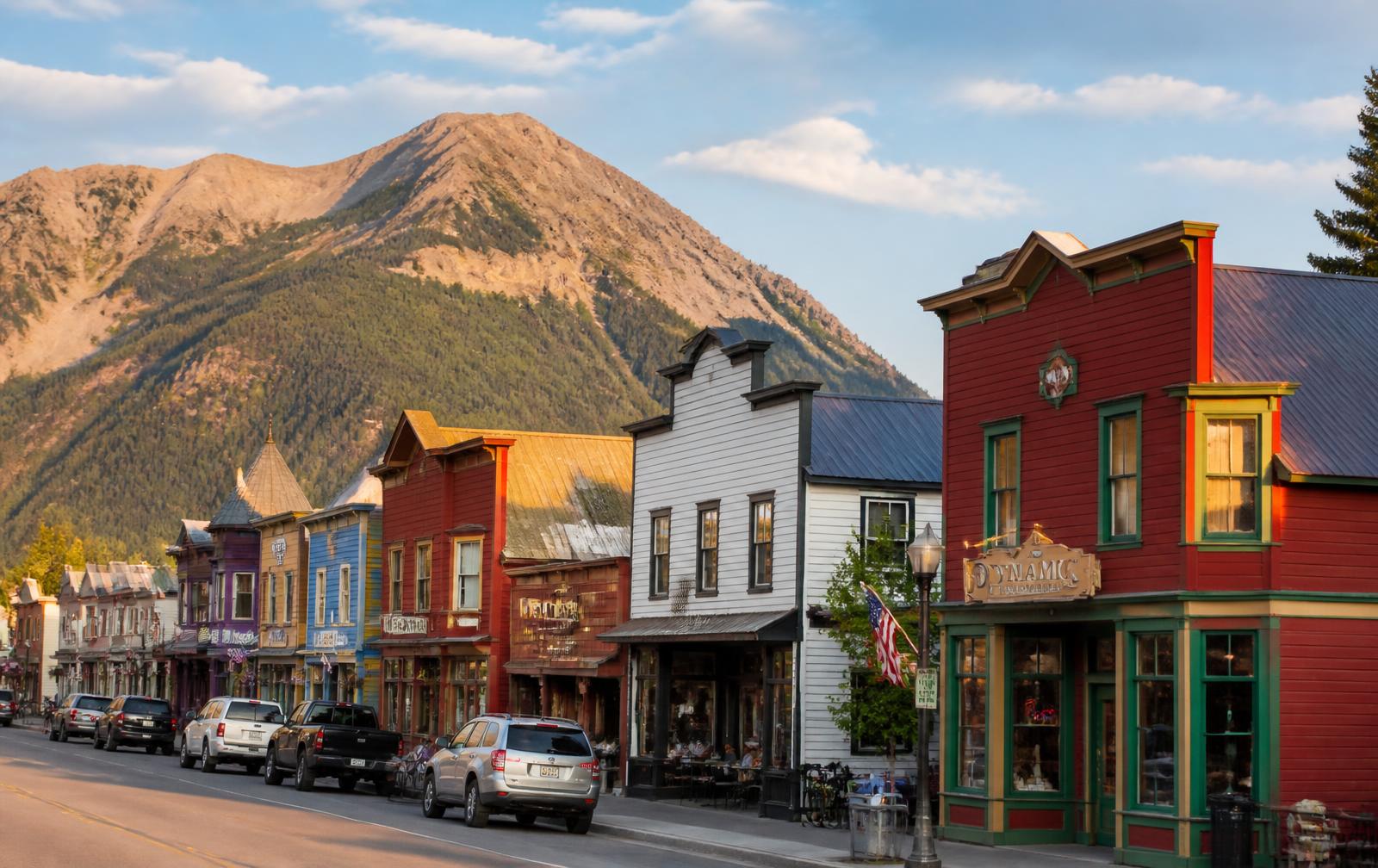 Elk Avenue in Crested Butte with historic storefronts beneath the mountains
